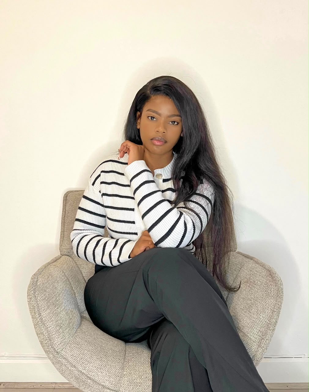 Zama Phewa, Clinical Psychologist, seated in an armchair